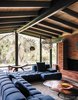 Modern home with Chair and Table. The architects maintained the midcentury post-and-beam construction and Japanese-inspired details of the original building, while brightening and expanding the interior living spaces. Patricia Urquiola’s Tufty-Time sofa for B&B Italia meets Pebble coffee tables by Nathan Yong for Ligne Roset in the living room. Photo 12 of Modernist Gem Revival