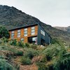 Modern home with Exterior, House Building Type, Metal Roof Material, Wood Siding Material, and Metal Siding Material. The location on the shores of a small bay means it is sheltered from cold southerly winds. The alpine location provided plenty of inspiration for landscaping, which Ritchie and Kerr elected to keep as minimal as possible, as if the home had landed on its site with as little disturbance or alteration as possible. Photo of Drift Bay House