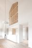 Modern home with Storage Room and Shelves Storage Type. Upstairs, a wooden slatted wall doubles as a bookshelf. Photo 7 of La Pedevilla