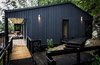 Modular corrugated steel protects the house against year-round rain. Home automation company Home Control outfitted the residence with energy-efficient LED lights and zone-specific audio systems. Photo 7 of Casa Lago Todos los Santos modern home