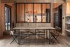 Pine wood "tejuelas," or planks used for cladding and ceilings, wrap the entire interior in keeping with the Southern Chile regional vernacular. Its muted tones speak to the surrounding environment as well. Photo 3 of Casa Lago Todos los Santos modern home