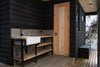Behind the house, a fish cleaning station leads to the laundry room and a storage room. Photo 9 of Casa Lago Todos los Santos modern home