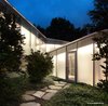 The original Breuer structure is connected to Mori’s addition by a triangulated glass corridor that includes a graduated staircase. Photo 7 of Marcel Breuer's New Canaan Home modern home