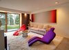 Shown here is the sitting room from the bottom half of the main house. As an art collector, the current homeowner has filled the entire interior with bold statement pieces. Photo 8 of Wiley House modern home