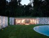 Taking a peek into the new pool house that helps enclose the area, you can see how the sloped land and the original stone walls allow it to remain surprisingly hidden from the outside. Photo 2 of Wiley House modern home