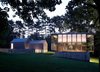 Built in 1953, the Wiley House is made up of a single glass-and-wood rectangular pavilion that’s perched on top of a rectangular box made of stone and concrete. Johnson chose the six-acre plot of land himself and was particularly fond of the natural slopes of the site, which is surrounded by hickory trees. Photo of Wiley House modern home