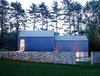 The stone treatment works as a connecting factor throughout the property and preserves a building practice that was common at the time. Photo 4 of Wiley House modern home