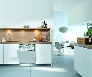 This white Miele model is designed to blend seamlessly into white kitchen cabinetry. The brand’s patented Knock2Open technology does away with handles, allowing for a completely flush facade that users can tap twice to gain access. It comes equipped with an adjustable cutlery tray and interior LED lights, and it automatically recognizes how full the load is and adjusts energy and water use accordingly. It's also one of the quietest dishwashers available at 38 decibels. 