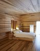 Modern home with Bedroom, Light Hardwood Floor, and Bed. The custom bed features under-mattress drawers. Photo 9 of Sliding House