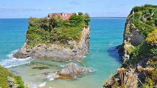 Perched atop an enormous rock that rises from the sea—and only accessible by a private suspension bridge—The Island in Newquay is complete with garden pergolas, an outdoor barbecue, and classic four-poster beds. 