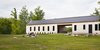 In rural Canada, an architect imports an American typology to create a year-round refuge rooted in the landscape. Photo of The Land House modern home