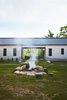 Modern home with Outdoor, Front Yard, Grass, Back Yard, and Side Yard. Architect Brian O’Brian and contractor Tom Clancy adapted a central breezeway, a distinguishing feature of dogtrot houses in the southeastern United States, for Joel and Michelle Loblaw’s cottage near the Georgian Bay in Meaford, Ontario. Photo 2 of The Land House