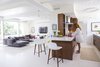 Modern home with Kitchen, Engineered Quartz Counter, Wood Cabinet, Pendant Lighting, Ceiling Lighting, Accent Lighting, and Rug Floor. A 1953 by Curtis and Davis in New Orleans’s Lakeshore neighborhood proved too tempting to pass up for veteran renovators Maury Strong, a film producer with an A-list client roster, and Ron Caron, a public school teacher. But the couple soon discovered that the flood-damaged structure with multiple sloppy renovations was a bigger challenge than they had imagined. With the help of a team led by Wayne Troyer and Natan Diacon-Furtado of studioWTA and the original architectural plans, they created a modern oasis to last a lifetime. Photo of Emerald Street Residence modern home