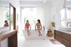 Modern home with Bath Room, Freestanding Tub, Pendant Lighting, Vessel Sink, and Wood Counter. In the master bathroom, a BainUltra Essencia freestanding tub with an Axor Starck filler offers a perch for the couple’s granddaughter Arabella and her cousin Alexandra. The built-in vanity is made of the same ApplePly material as the kitchen cabinetry. Photo 8 of Emerald Street Residence