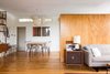 Andrew and Dustin were meticulous in their selections for the home’s furnishings and fixtures. In the dining area, a Vista of California table by Don Knorr is surrounded by Van Keppel-Green chairs. Photo 3 of The Romano-Ferrer Residence modern home