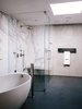 Modern home with Bath Room, Marble Wall, Ceramic Tile Floor, Freestanding Tub, and Enclosed Shower. In the master bathroom, a freestanding Waterworks tub is paired with a Fantini fixture. Calacatta marble surrounds the shower; the flooring is Evolution ceramic tile from Apavisa. Photo 7 of Conrad Residence