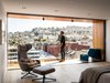 Modern home with Bedroom, Bed, Chair, Ceiling Lighting, and Recessed Lighting. Tom Conrad and Kate Imbach’s first bedroom redo creates as many problems as it alleviated, blocking their view of Noe Valley behind a wall, for instance. Their second attempt, shown here, opened up the balcony, which has a Frame lounge by Francesco Rota for Paola Lenti. A Grand Repos chair by Antonio Citterio for Vitra faces the bed. Photo 2 of Conrad Residence