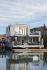 Modern home with Large Patio, Porch, Deck, Hanging Lighting, and Outdoor. Automatic retractable Sky-Frame windows open the living room completely on two sides. Photo 3 of Floating Dreams Residence