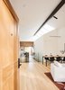 Modern home with Table, Wood Tread, Sofa, and Kids Room. Above an enclosed volume containing a powder room and guest room, a quartet of skylights brightens the living and dining area. A Sonneman Stiletto pendant offers extra light. Photo 7 of Dogpatch Cottage