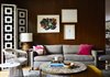 Modern home with Living Room, Ottomans, Chair, Coffee Tables, Sofa, Lamps, Table Lighting, End Tables, Light Hardwood Floor, and Rug Floor. A Petal end table by Richard Schultz is paired with a Platner armchair. These classics mingle with newer items, such as a Desmond room divider by Jonathan Adler and a sofa by Mitchell Gold + Bob Williams. Photo 11 of The Marrone/Nocera Residence