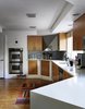 Modern home with Kitchen, Undermount Sink, Wood Cabinet, and Engineered Quartz Counter. The residents added double-glaze windows, low-VOC paints, and Energy Star appliances, calling on help just once, to install the Cambria quartz countertop in the kitchen. Photo 3 of The Marrone/Nocera Residence