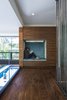 Modern home with Hallway and Medium Hardwood Floor. The second-floor niche, which is lined in Osborne & Little fabric, offers a quiet getaway. Photo 10 of Walnut House