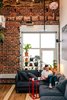 Modern home with Living Room, Sofa, End Tables, and Medium Hardwood Floor. Inside his San Francisco living room, Max Heinritz kicks back on a Söderhamn sectional from IKEA. “In Tokyo, everything is space- efficient, nothing is wasted,” he says. “I’m sort of going for that, too.” Photo 2 of Max's Apartment