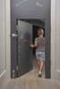 Modern home with Kids Room, Toddler Age, Neutral Gender, and Playroom Room Type. In certain places, the scale of the home is adjusted for children. A standard door, covered in chalk-board paint, has a 48-inch-tall door set inside it. Photo 6 of Division Street Triplex