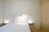 Modern home with Bedroom, Bed, Wardrobe, Night Stands, Storage, Wall Lighting, Table Lighting, and Medium Hardwood Floor. The bed, bedside tables, and console are all designed by Miguel Marcelino. The Glo-Ball bedside lamps are by Jasper Morrison and the Tolomeo wall lamp is by Michele De Lucchi.
-
Lisbon, Portugal
Dwell Magazine : July / August 2017 Photo 5 of The Henriques/Moreira Residence