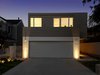 Modern home with Outdoor, Front Yard, and Hardscapes. The facade of the home displays a combination of materials: painted brick on the ground floor and stained cedar above. Photo 2 of The Ro Residence