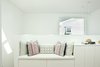 Modern home with Hallway. The upstairs corridor features a custom bench and cushions. Large skylights provide an abundance of natural light. Photo 7 of The Ro Residence