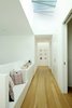 Modern home with Hallway and Medium Hardwood Floor. Large skylights provide an abundance of natural light. The operable skylights are by Industrial Skylights. Photo 8 of The Ro Residence