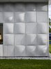 Modern home with Outdoor, Side Yard, and Grass. “For the majority of the day, when the sun is high, you almost don’t notice the texture on the exterior. It just fades into a flat wash,” says designer Nick Gelpi of the undulating wood-based concrete tiles that clad his home in Miami Beach. “But at moments, the sun hits at a certain angle and really activates the surface.”
-
Miami, Florida
Dwell Magazine : July / August 2017 Photo 2 of Exotic Concrete House