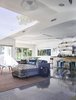 Modern home with Living Room, Stools, Sofa, Ceiling Lighting, and Terrazzo Floor. When the house’s existing slab proved too damaged, Gelpi opted for a terrazzo floor tile by Perpetua in the same dimensions as the exterior tiles.
-
Miami, Florida
Dwell Magazine : July / August 2017 Photo 7 of Exotic Concrete House