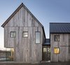 Modern home with Outdoor and Side Yard. A combination of Alumilex and Marvin windows dot the exterior of a pitched-roof house in North Hatley, Quebec, designed by Lee and Macgillivray Architecture Studio (LAMAS).
-
North Hatley, Quebec
Dwell Magazine : July / August 2017 Photo 2 of Townships Farmhouse