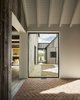 Modern home with Hallway and Brick Floor. The placement of the windows creates sight lines across the 4,770-square-foot structure. Northern Wide Plank sourced the reclaimed hemlock for the facade; Sherma Construction picked the specific boards to create a cohesive look.
-
North Hatley, Quebec
Dwell Magazine : July / August 2017 Photo 3 of Townships Farmhouse