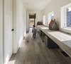Modern home with Hallway and Medium Hardwood Floor. Antique-looking birdhouses are displayed in a hallway office space upstairs.
-
North Hatley, Quebec
Dwell Magazine : July / August 2017 Photo 10 of Townships Farmhouse
