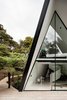Modern home with Outdoor, Front Yard, Trees, Wood Patio, Porch, Deck, and Small Patio, Porch, Deck. The tent-like home responds to the challenging site in a dynamic way. Photo 2 of The Tent House