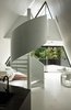 Modern home with Staircase, Metal Railing, and Metal Tread. The sharp ridgeline and soaring soffit reference a tent-like experience in an architecturally elegant way. Photo 4 of The Tent House