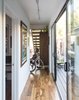 Modern home with Hallway and Medium Hardwood Floor. Ensuring that the house would be accessible for wheelchair users like Marielle Kriesel, who serves on the Santa Monica Disabilities Commission with TJ, guided the design.
-
Santa Monica, California
Dwell Magazine : July / August 2017 Photo 4 of Hill-Heiserman House
