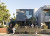 Modern home with Outdoor, Front Yard, Hardscapes, Trees, and Horizontal Fences, Wall. “We always knew we wanted to do prefab—here it is something interesting and beautiful that adds to the character of the street,” says TJ (on deck, with Jay, left, and Chloe). “There weren’t many options for staying in the area with a growing family,” notes Stott.
-
Santa Monica, California
Dwell Magazine : July / August 2017 Photo 5 of Hill-Heiserman House