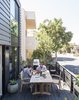 Modern home with Outdoor, Trees, Large Patio, Porch, Deck, Front Yard, and Planters Patio, Porch, Deck. For the front deck, the couple chose a dining set by Teak Smith; the driftwood and metal corkscrew is by sculptor David Tanych.
-
Santa Monica, California
Dwell Magazine : July / August 2017 Photo 6 of Hill-Heiserman House