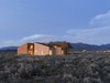 Modern home with Desert, Shrubs, Exterior, Stucco Siding Material, House Building Type, and Wood Siding Material. On a five-acre property outside Taos, New Mexico, designer Molly Bell worked closely with her father, builder Ed Bell, to create a new residence for owner Lois Rodin. “Lois requested that it appear as a grouping of individual masses, so that it read more like a cluster than a solitary shape,” Molly says. “I hope it shows that it’s OK to do something modern in such a traditional environment, and not to be afraid of it.”
-
Taos, New Mexico
Dwell Magazine : July / August 2017 Photo 2 of Rodin Residence