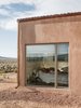 Modern home with Outdoor, Side Yard, Shrubs, and Hardscapes. A gravel perimeter keeps mud from splashing on the walls when it rains. Adds Molly, “You can get away with minimal landscaping because there’s so much natural vegetation here.”
-
Taos, New Mexico
Dwell Magazine : July / August 2017 Photo 6 of Rodin Residence