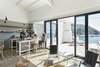 Modern home with Kitchen, Refrigerator, Ceramic Tile Floor, Range, Wall Lighting, and Drop In Sink. Thanks to a careful renovation that included a handful of preservation challenges, a family's Spanish beach house is given new life—and a big dose of light.
Situated along the historic Camí de Ronda footpath in Spain's Costa Brava region, the Es Garbi beach house was renovated by Nook Architects to reflect the light and tranquility of the surrounding Mediterranean landscape, as well as to function as a well-designed family home. Photo of Es Garbi Beach House