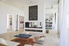 Modern home with Living Room, Rug Floor, Ottomans, Recessed Lighting, Two-Sided Fireplace, Coffee Tables, Wood Burning Fireplace, and Sofa. The whole house is air-conditioned and for the winter there is central heating and a fireplace for guests to enjoy. Photo 4 of Amizmiz House