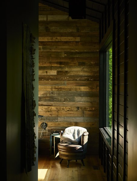 In each room, a single wall was clad in reclaimed poplar. An antique barrel chair sits in the master bedroom.


Scaly Mountain, North Carolina
Dwell Magazine : September / October 2017
