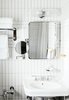 Modern home with Bath Room, Wall Mount Sink, Wall Lighting, and Subway Tile Wall. Amenities include wellness facilities, fitness rooms, saunas, a multi-sports court, an outdoor pool, and a central location close to numerous vineyards and farms. For those looking for a weekend indoors, the hotel’s Piano Bar offers guests live music with a beachfront backdrop. A private library is also available to guests looking for extra relaxation. Photo 7 of Sound View Greenport