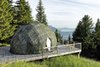Modern home with Exterior, Cabin Building Type, Prefab Building Type, Dome RoofLine, Glass Siding Material, and Tent Building Type. The color of the pods is adapted to each season: white in winter, green in summer. Photo 2 of Whitepod Eco-Luxury Hotel