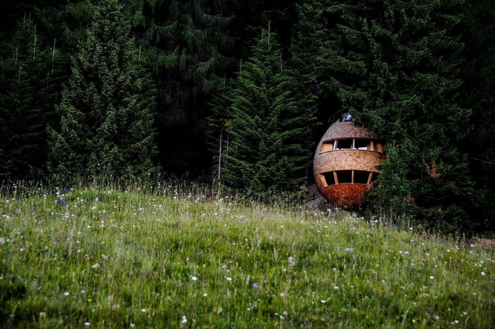 In the woods of Malborghetto Valbruna in the Italian Dolomite commune of Tarvisio reside a pair of egg-shaped tree houses.